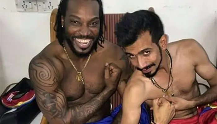 Chris Gayle and Yuzvendra Chahal showing their muscles.