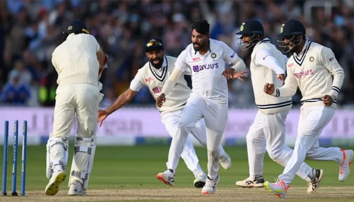 Indian players celebrate after taking the last wicket of the England team at Lords.