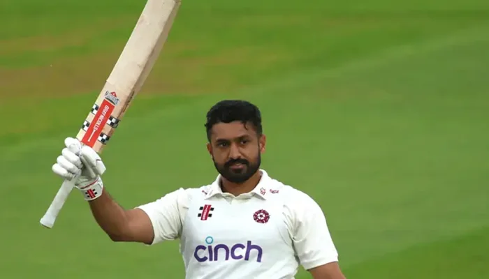 Karun Nair celebrating his century in County Championship for Northamptonshire.