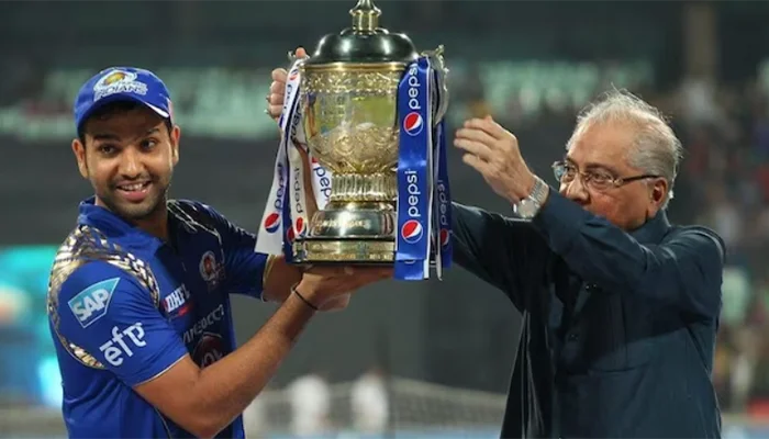 Rohit Sharma holding the IPL 2013 title.