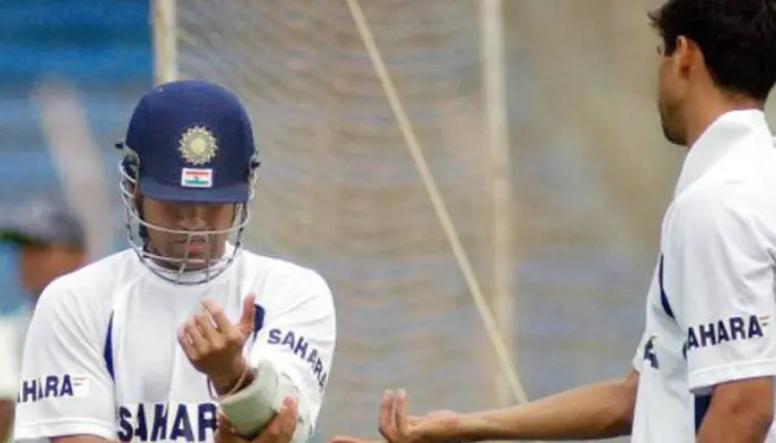 Sachin Tendulkar adjusting his arm-guard during a practice session of the Indian team.