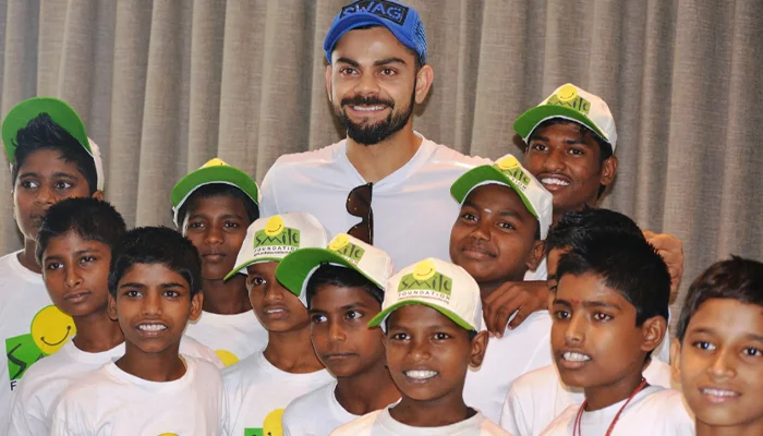 Virat Kohli spending time with unprivileged young children.